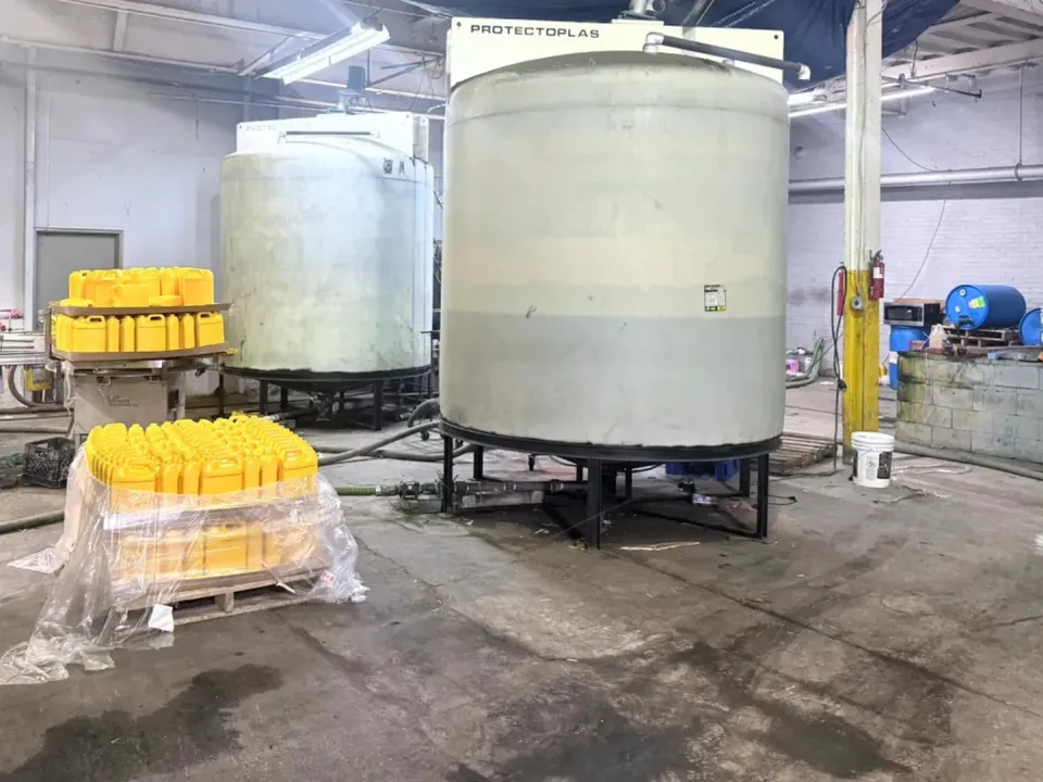 Production tanks beside filled yellow containers