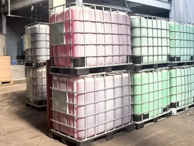 Rows of IBC totes holding coolant in several colors