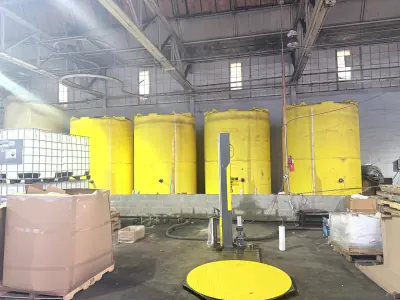 Bulk storage tanks beside the pallet wrapping station